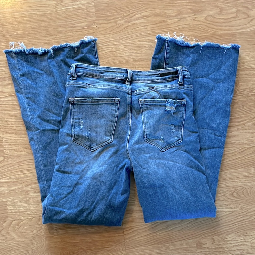 Risen boot cut, size 11/30 jeans, distressing at bottom of leg